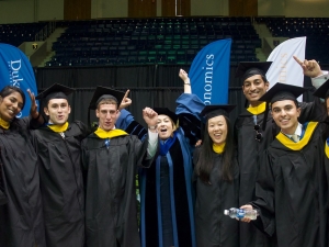 Duke Economics honors program students and Professor Michelle Connolly at the department's commencement ceremony in 2017.