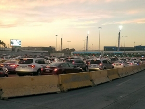 Cars line up to pass a border crossing