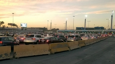 Cars line up to pass a border crossing