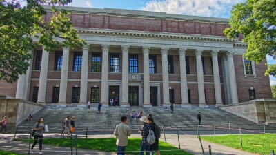 Harvard library with students walking in front 