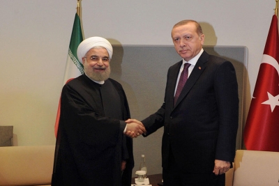 Erdogan and Rouhani shaking hands