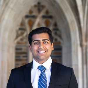 Portrait photo of Abhinav Kolli with Duke Chapel arches in the background